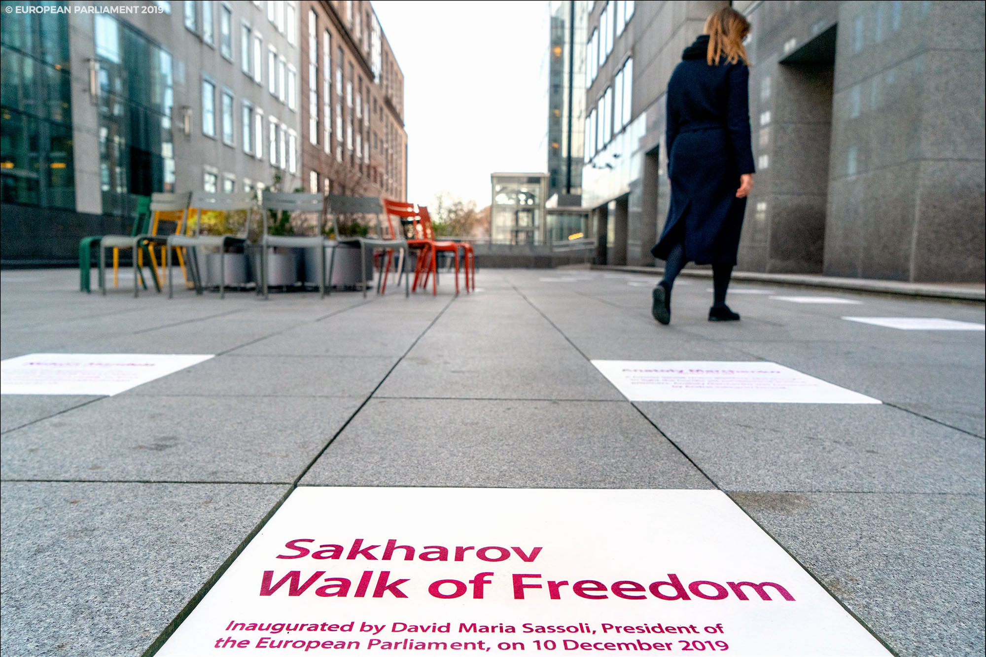 Path next to European Parliament building with a commemoration plague Sakharov Walk