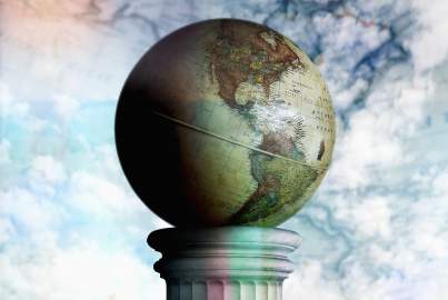 A vintage globe stands on a column