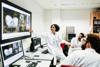 Picture of doctors looking on screens