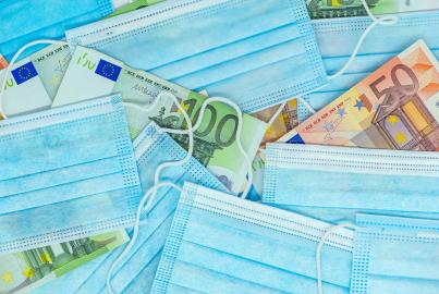 Medial face mask and a bundle of the Euro banknote