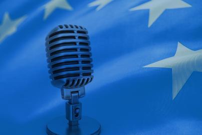 Studio microphone in front of EU flag